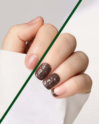 A close-up of a hand with glossy brown nail wraps featuring a textured, embossed pattern, shown against a clean white and light gray background with a diagonal green line overlay.